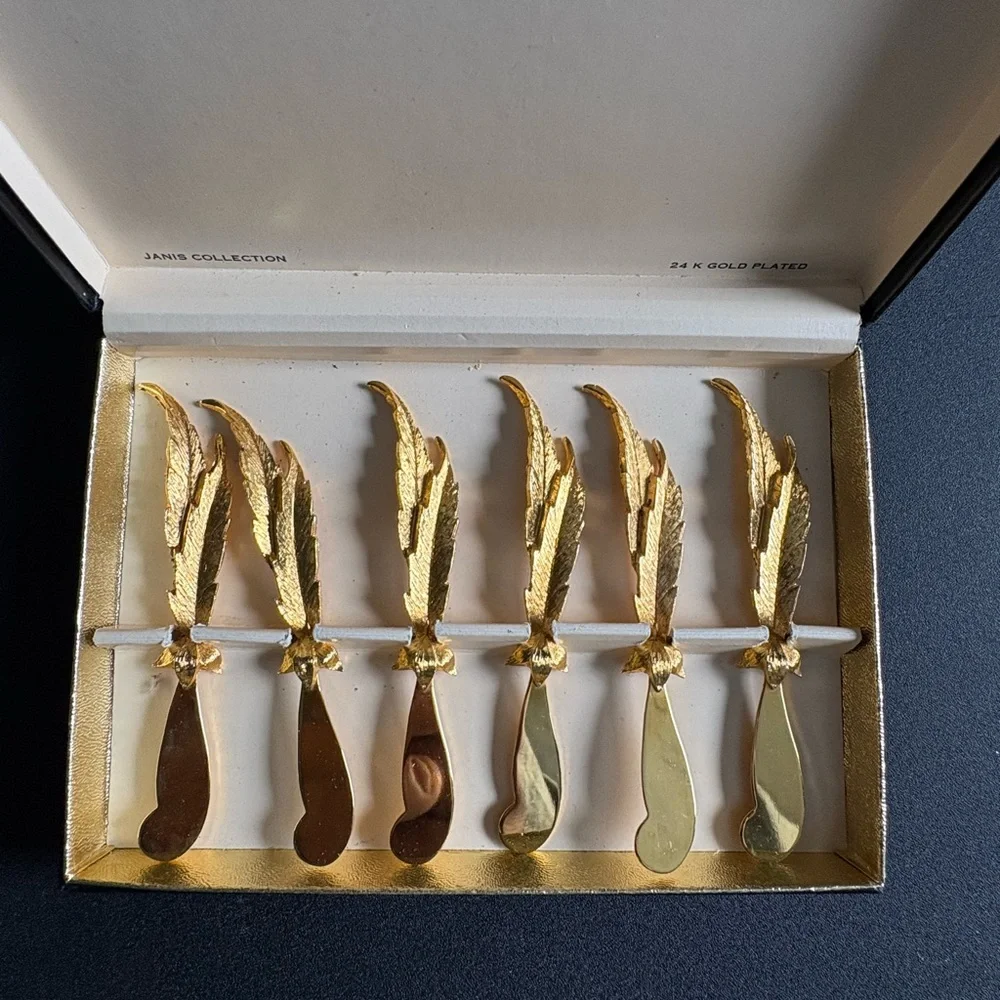 Vintage Janis Collection set of 6 feather-shaped spreaders plated in 24k gold.